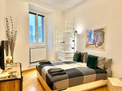 a bedroom with a large bed in a room at Luxury Apartment Spanish Steps in Rome