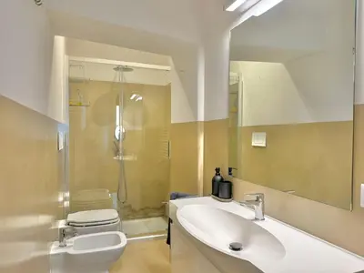 a bathroom with a sink and a toilet and a shower at Luxury Apartment Spanish Steps in Rome