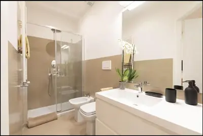 a bathroom with a sink and a toilet and a shower at Luxury Apartment Spanish Steps in Rome