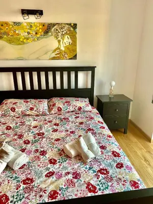 a bed with two pillows on it in a bedroom at Attico con balcone in Rome