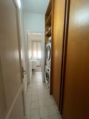 a hallway of a bathroom with a washing machine at MichelleHouse in Rome