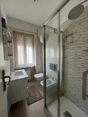 a bathroom with a shower and a sink and a toilet at MichelleHouse in Rome