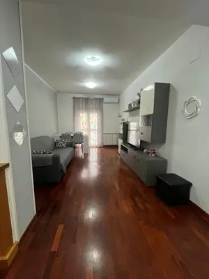 a living room with a couch and a television at MichelleHouse in Rome