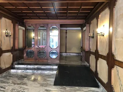 an empty hallway with a door with chairs in it at Casa Salù in Rome
