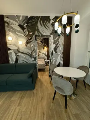 a living room with a couch and a table at Heart Of Rome Luxe Suite in Rome