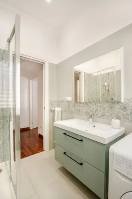 a bathroom with a sink and a mirror at Roma San Pietro - Vatican Vibes apartment in Rome