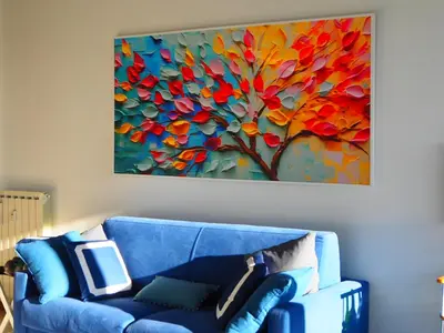 a blue couch in a room with a painting on the wall at Serendiroma in Rome