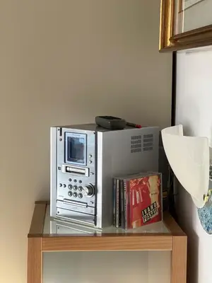 a microwave oven sitting on a wooden table at Serendiroma in Rome