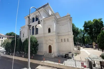 a white church with a street light in front of it at Luxury home in the Ghetto's heart in Rome