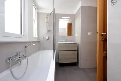 a bathroom with a shower and a sink at Luxury home in the Ghetto's heart in Rome