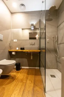 a bathroom with a shower and a toilet and a sink at Trastevere Spot in Rome