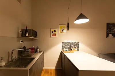 a kitchen with a sink and a counter top at Trastevere Spot in Rome