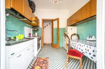 a kitchen with a sink and a counter top at Espress break in Rome