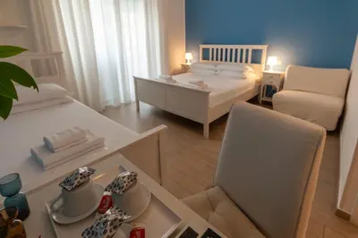 a small room with a bed and a table and chairs at Magna Cura in Rome