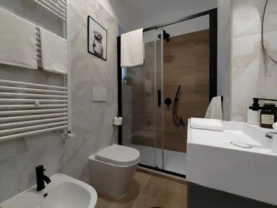 a bathroom with a toilet and a sink and a shower at A casa di nonna Lina - Apartment in Ostiense in Rome