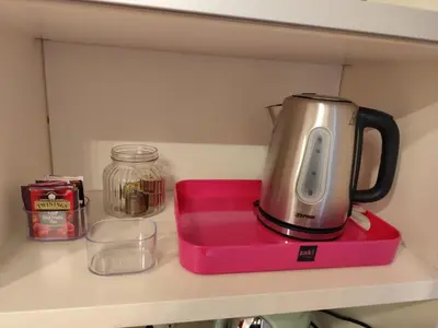 a blender sitting on top of a pinkounter on a shelf at Lovely Flat Roma Università in Rome