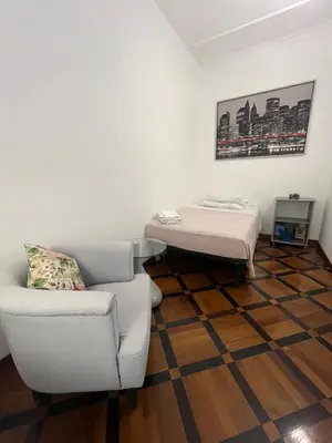 a room with a bed and a couch and a table at HOUSE BOCCEA Rome in Rome