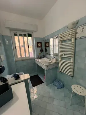 a bathroom with a sink and a toilet and a tub at HOUSE BOCCEA Rome in Rome