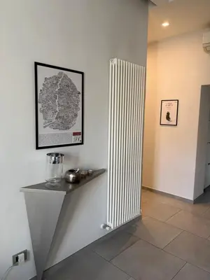 a white radiator in a room with a wall at Casa Gabri in Rome