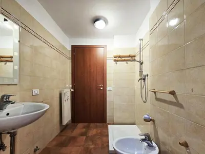 a bathroom with a sink and a mirror at Comfort House Coppedé in Rome
