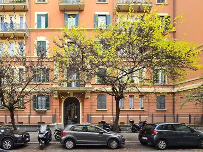 a group of cars parked in front of a building at Comfort House Coppedé in Rome