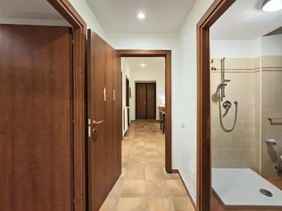 a bathroom with a walk in shower and a toilet at Comfort House Coppedé in Rome