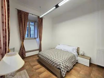 a bedroom with a bed and a window at Comfort House Coppedé in Rome
