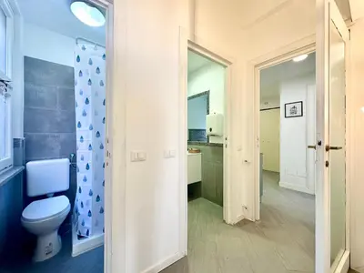 a bathroom with a toilet and a sink at Sergio I Apartment in Rome