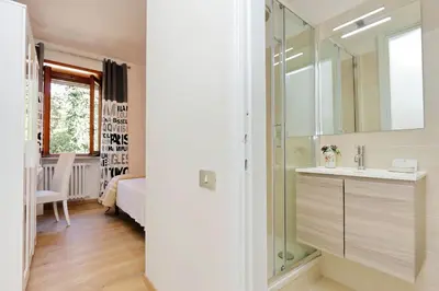 a bathroom with a sink and a mirror at Antico Platano in Rome