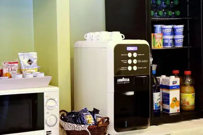 a microwave oven sitting next to a refrigerator at Antico Platano in Rome