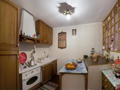 a kitchen with a counter with a bowl of fruit on it at Nido tra le cupole, terrazza panoramica, Wi-Fi , AC in Rome
