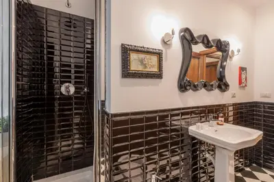 a bathroom with a sink and a shower at ROMA 1 - Elegante Appartamento con Terrazzo in Rome