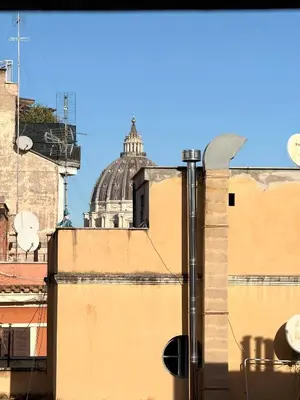 a building with a dome on top of it at Maison Fortuna in Rome