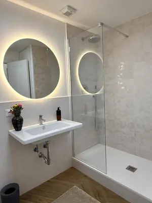 a bathroom with a sink and a shower at Maison Fortuna in Rome