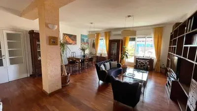 a living room filled with furniture and a dining room at Lepanto Lovely Apartment in Rome