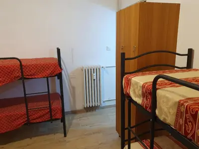 a room with two bunk beds and a radiator at Tom 38 in Rome