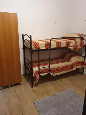 a bedroom with two bunk beds and a closet at Tom 38 in Rome
