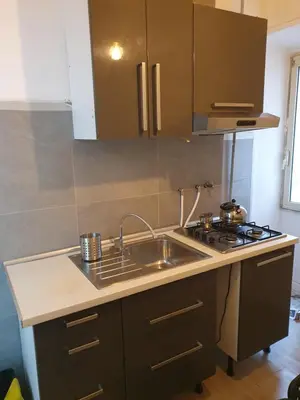 a kitchen with a sink and a stove at Tom 38 in Rome