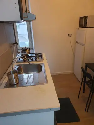 a kitchen with a sink and a counter top at Tom 38 in Rome