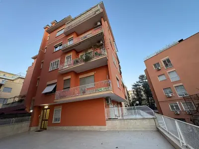 an orange building with balconies on the side of it at Little Diamond in Gianicolense in Rome