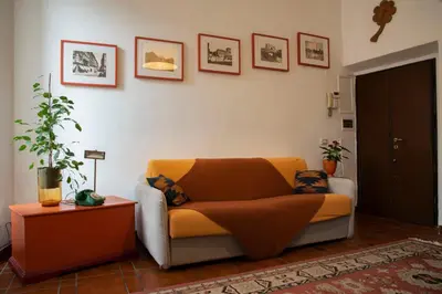 a living room with a couch and a table at Fissa Dimora in Rome