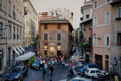 a group of people walking down a city street at Fissa Dimora in Rome