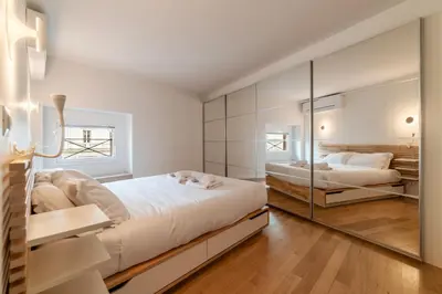 a bedroom with two beds and a large mirror at Luxury 3 beds 3 baths, few steps from city center in Rome