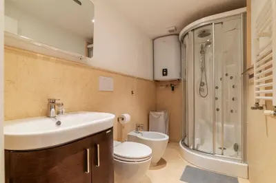 a bathroom with a sink and a toilet and a shower at Luxury 3 beds 3 baths, few steps from city center in Rome
