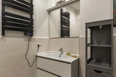 a bathroom with a sink and a mirror at The Mirror Suite next to Spanish Steps in Rome