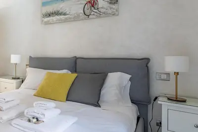 a bedroom with a bed with towels on it at Iflat Cozy Flat at two steps from Vatican in Rome
