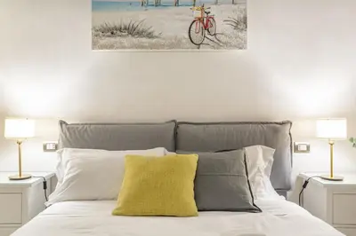 a bedroom with a bed with a yellow pillow at Iflat Cozy Flat at two steps from Vatican in Rome