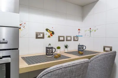 a kitchen with a table with two mugs on it at Iflat Cozy Flat at two steps from Vatican in Rome