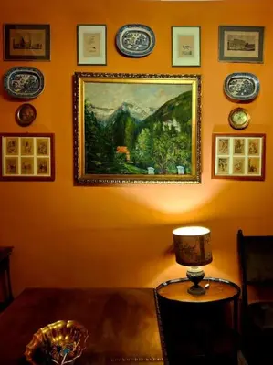 a room with a painting on the wall and a table with a lamp at Casa di Michele in Rome