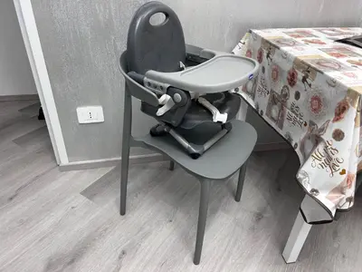 a high chair sitting next to a table at Breath of Rome 5 min a piedi metro B San paolo poche fermate dal centro di Roma in Rome